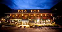 a large building with lights on it at night at Auberge du Manoir in Chamonix