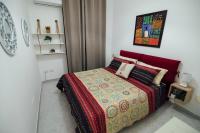 A bed or beds in a room at Via Vittorio Emanuele Apartment