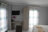Televízia a/alebo spoločenská miestnosť v ubytovaní Apartamentos Maro VG