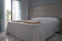 Posteľ alebo postele v izbe v ubytovaní Apartamentos Maro VG