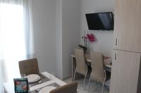 Televízia a/alebo spoločenská miestnosť v ubytovaní Apartamentos Maro VG