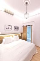 Postel nebo postele na pokoji v ubytování Hostal Girona