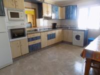 Kuchyň nebo kuchyňský kout v ubytování Apartamentos Las Llábanas