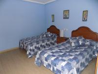 Postel nebo postele na pokoji v ubytování Apartamentos Las Llábanas
