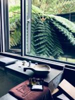 a bathroom with a sink and a large window at CHECK inn Select Taipei Yamgmingshan in Taipei