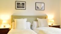 Postel nebo postele na pokoji v ubytování Hostal Girona