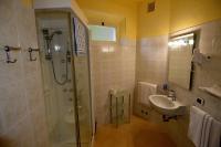 a bathroom with a sink and a shower and a toilet at Hotel Villa Ruscello in Baveno