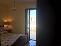 A bed or beds in a room at Favignana Margot House
