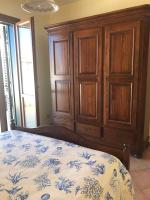 A bed or beds in a room at Favignana Margot House