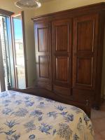 A bed or beds in a room at Favignana Margot House