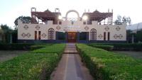 a building with hedges in front of it at Applicators Hotel in Abu Simbel
