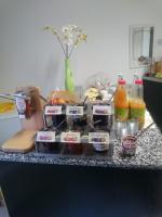 a counter with some food and drinks on it at Hotel Asterra in Saalfeld