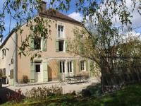 a house with a picnic table in front of it at Beautiful country house with enclosed garden in green surroundings in Burgundy in Bouix