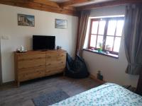 Telewizja i/lub zestaw kina domowego w obiekcie Family House 94
