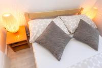 Postel nebo postele na pokoji v ubytování Apartments in city center Ventus