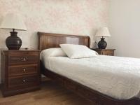 A bed or beds in a room at Hotel Rural Nova Ruta