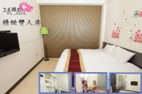 a hotel room with a bed and a tv at Sanyi Sakura Resort in Sanyi