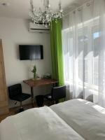 A television and/or entertainment centre at Enjoyit Rooms