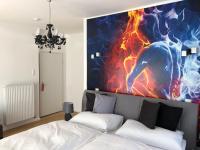 A bed or beds in a room at Enjoyit Rooms