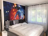A bed or beds in a room at Enjoyit Rooms