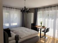 A bed or beds in a room at Enjoyit Rooms