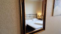 Posteľ alebo postele v izbe v ubytovaní Hotel Goldene Spinne