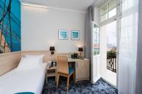 Łóżko lub łóżka w pokoju w obiekcie Hotel Eureka