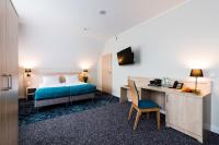 Łóżko lub łóżka w pokoju w obiekcie Hotel Eureka