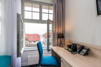 Telewizja i/lub zestaw kina domowego w obiekcie Hotel Eureka