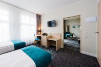 Telewizja i/lub zestaw kina domowego w obiekcie Hotel Eureka