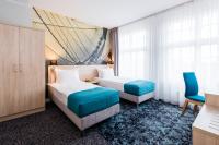 Łóżko lub łóżka w pokoju w obiekcie Hotel Eureka