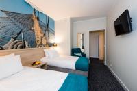 Telewizja i/lub zestaw kina domowego w obiekcie Hotel Eureka