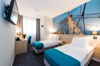 Łóżko lub łóżka w pokoju w obiekcie Hotel Eureka