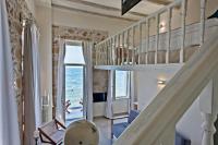 Televízia a/alebo spoločenská miestnosť v ubytovaní Thalassa Boutique Hotel