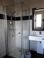 a bathroom with a shower and a sink at Hôtel Evian Express - Terminus in Évian-les-Bains