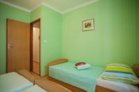 Postel nebo postele na pokoji v ubytování Apartments Dabović
