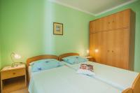 Postel nebo postele na pokoji v ubytování Apartments Dabović