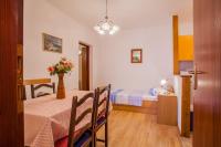 Postel nebo postele na pokoji v ubytování Apartments Dabović