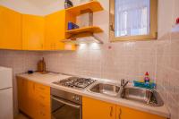 Kuchyň nebo kuchyňský kout v ubytování Apartments Dabović
