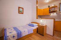 Postel nebo postele na pokoji v ubytování Apartments Dabović