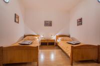 Postel nebo postele na pokoji v ubytování Apartments Dabović