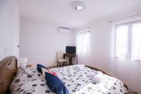 Cama ou camas em um quarto em Sunrise Apartments