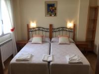Postel nebo postele na pokoji v ubytování Hostal Santa Baia