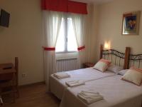 Postel nebo postele na pokoji v ubytování Hostal Santa Baia