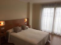 Postel nebo postele na pokoji v ubytování Hostal Santa Baia