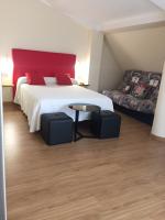 Postel nebo postele na pokoji v ubytování Hostal Santa Baia
