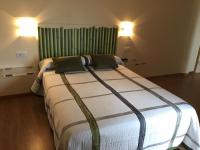 Postel nebo postele na pokoji v ubytování Hostal Santa Baia