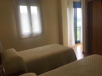 Postel nebo postele na pokoji v ubytování Hostal Santa Baia