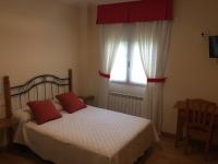 Postel nebo postele na pokoji v ubytování Hostal Santa Baia