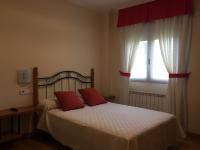 Postel nebo postele na pokoji v ubytování Hostal Santa Baia